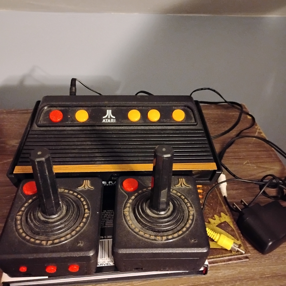 Atari Classic Console with Black and Orange Design